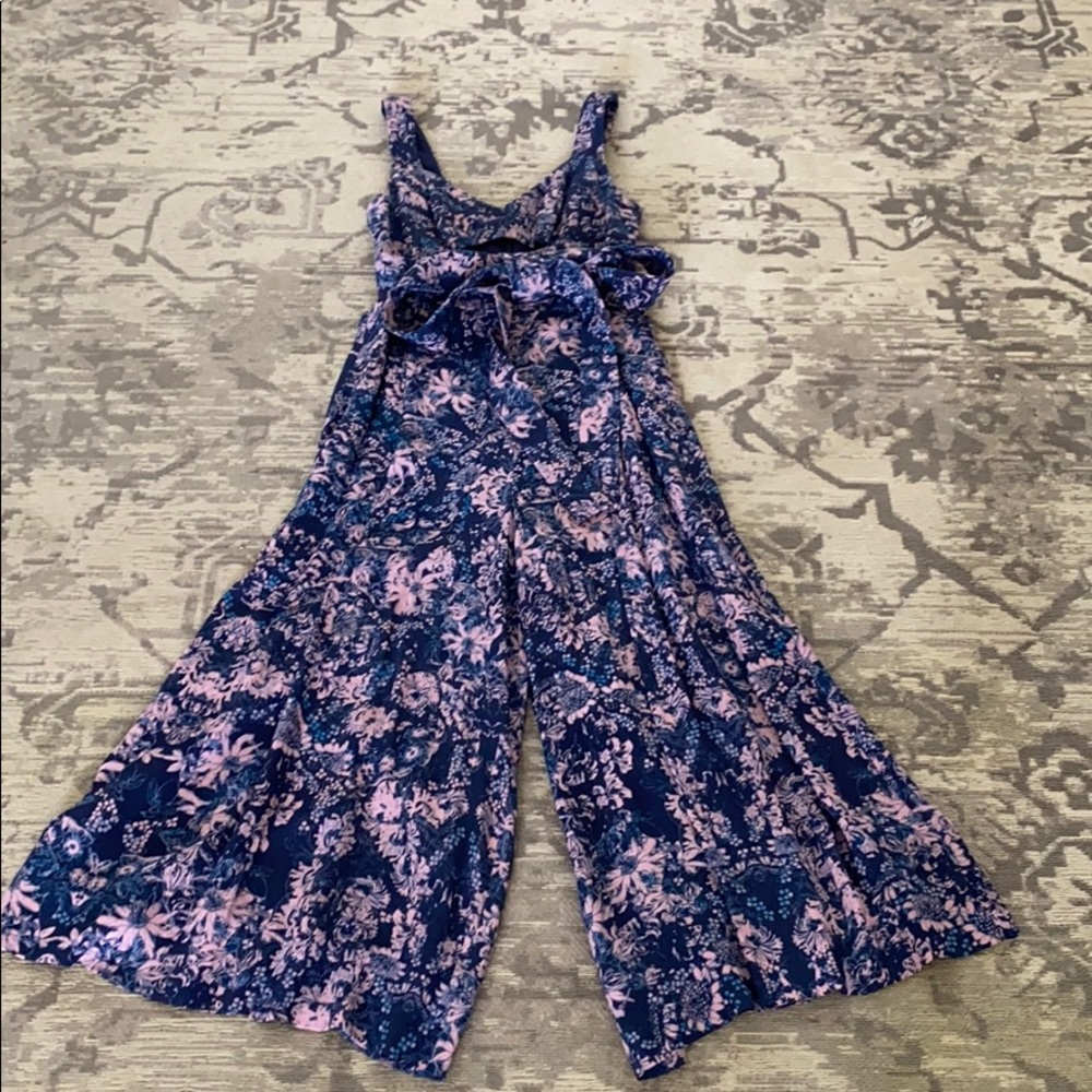 Floral romper with cutout detail.